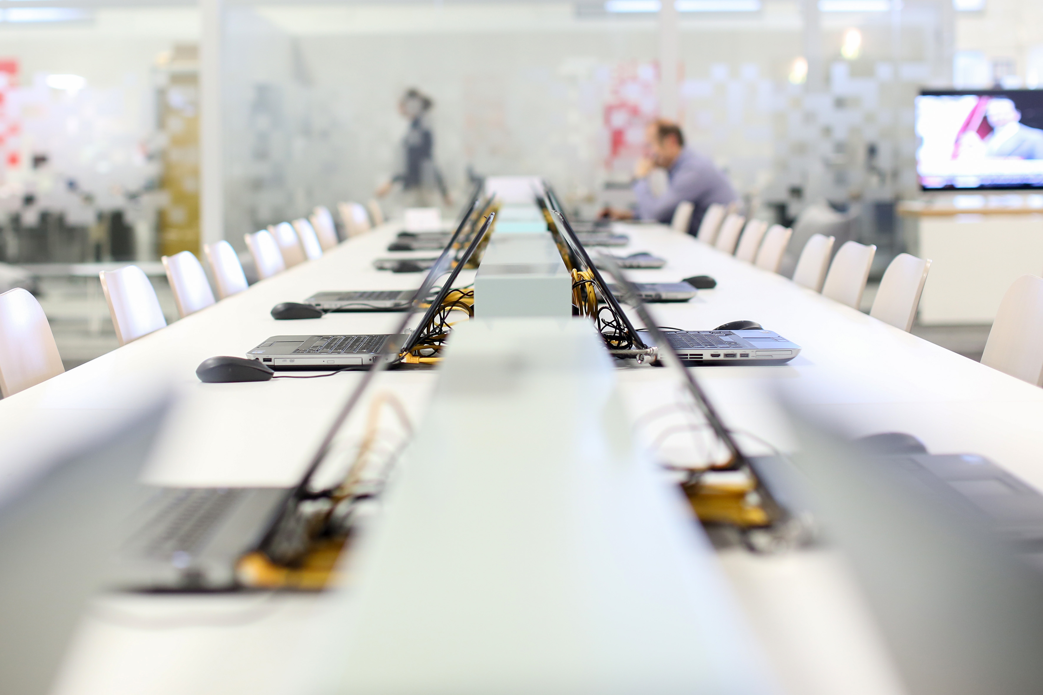 Numerous notebooks on a long table